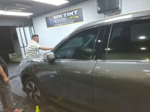 The Ultimate Guide to Color PPF and Color Wraps: Enhancing Your Vehicle's Protection and Appearance 3 PPF Working in workshop