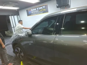 The Ultimate Guide to Color PPF and Color Wraps: Enhancing Your Vehicle's Protection and Appearance 3 PPF Working in workshop
